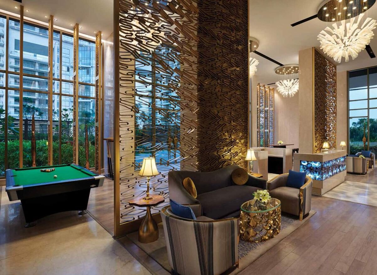M3M Golfestate resort swimming pool with poolside pergola seating, Sector 65 Gurugram