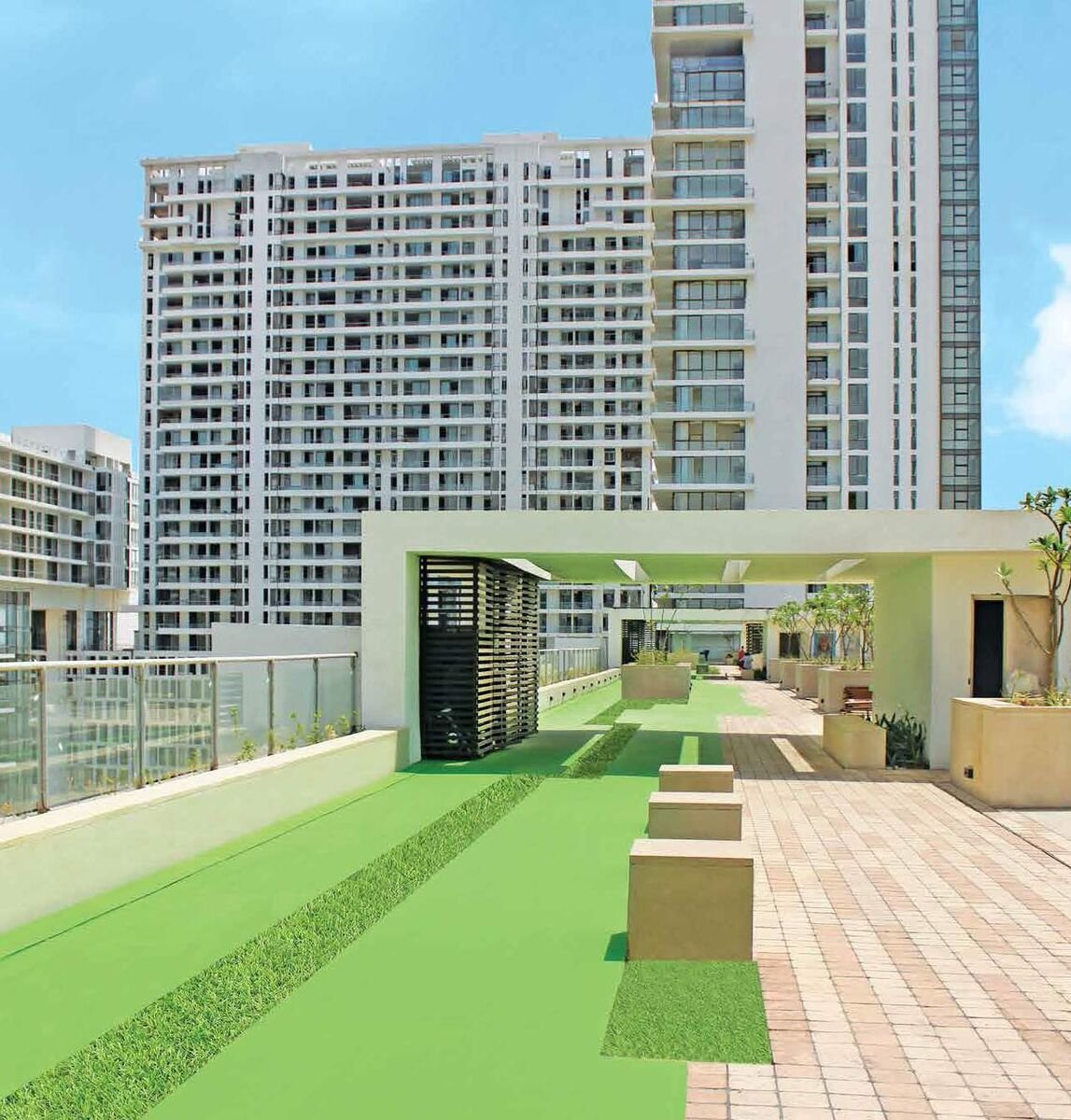 M3M Golfestate landscaped podium putting green between towers, Sector 65 Gurugram
