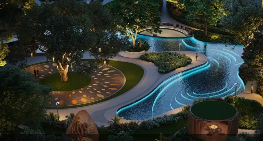 Illuminated water park at the Central Grove of M3M Forestia West at night