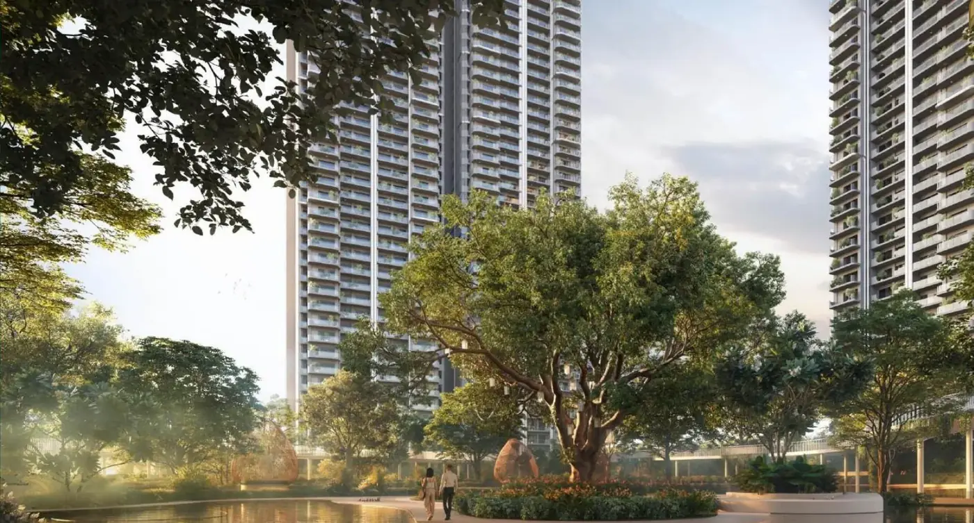 M3M Forestia West towers and central grove lake at golden hour, Manesar