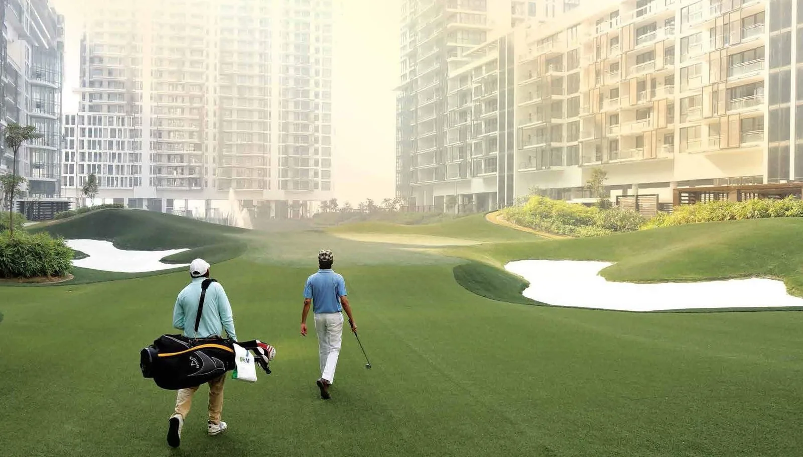 Residents on the 9-hole executive golf course at M3M Golf Estate