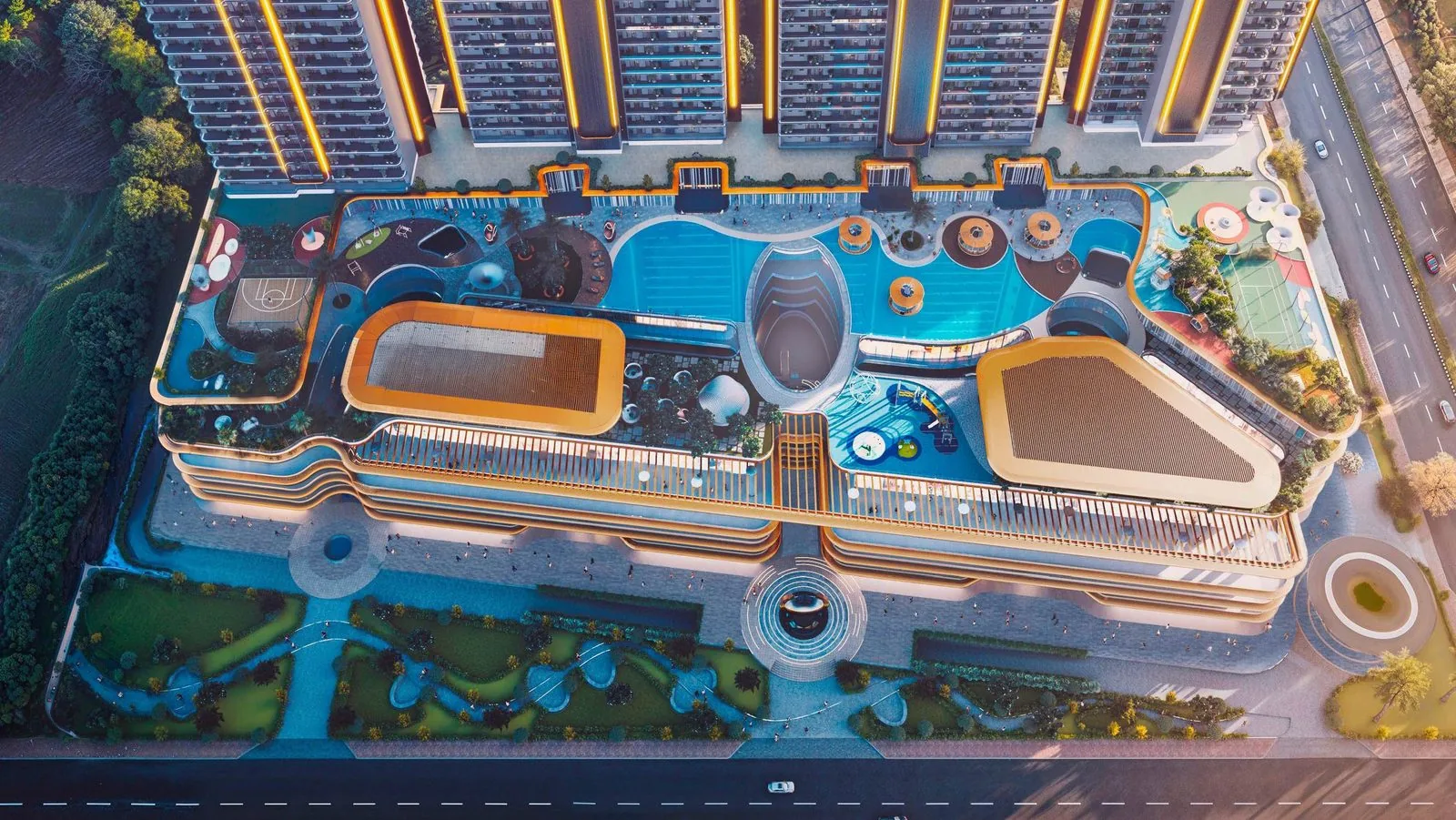 Aerial of the podium sports courts, kids' zones and lagoon pool at M3M Jacob & Co Residences