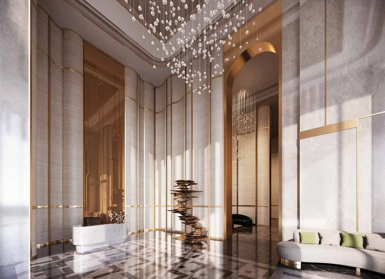 Double-height grand lobby with marble and gold detailing at M3M Mansion