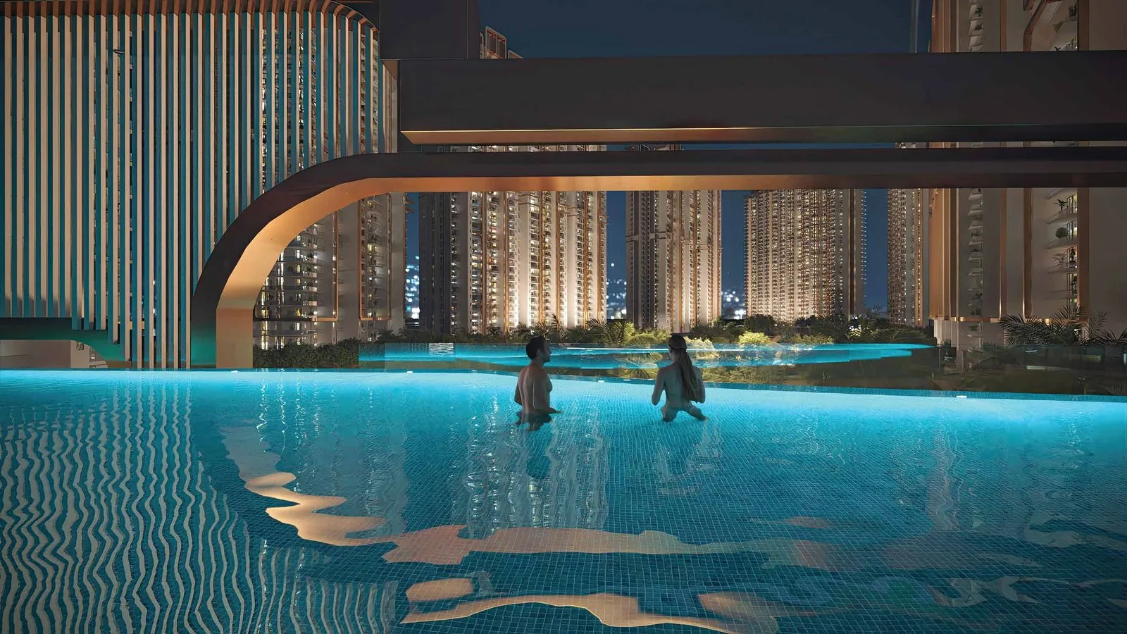 M3M Mansion towers and infinity pool illuminated at dusk, Sector 113 Dwarka Expressway