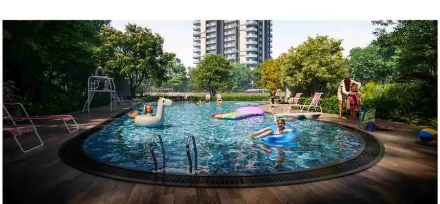Private pool reserved for M3M Opus residents with sun loungers and timber deck