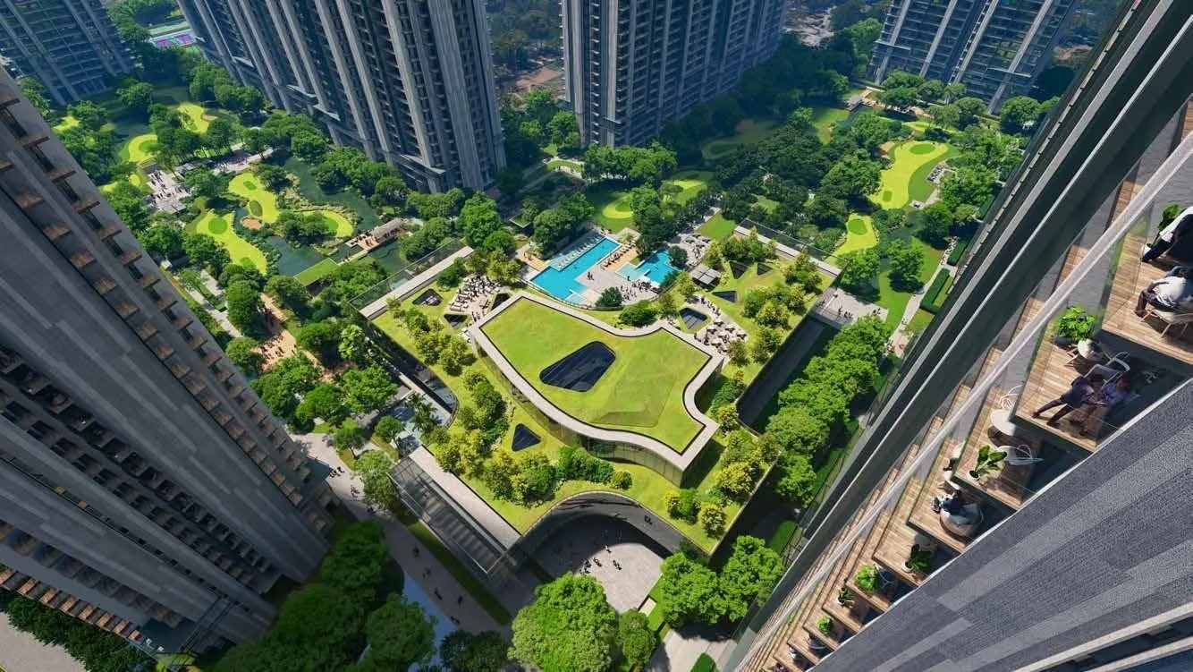 Aerial of an M3M landscaped residential development with pools and greens