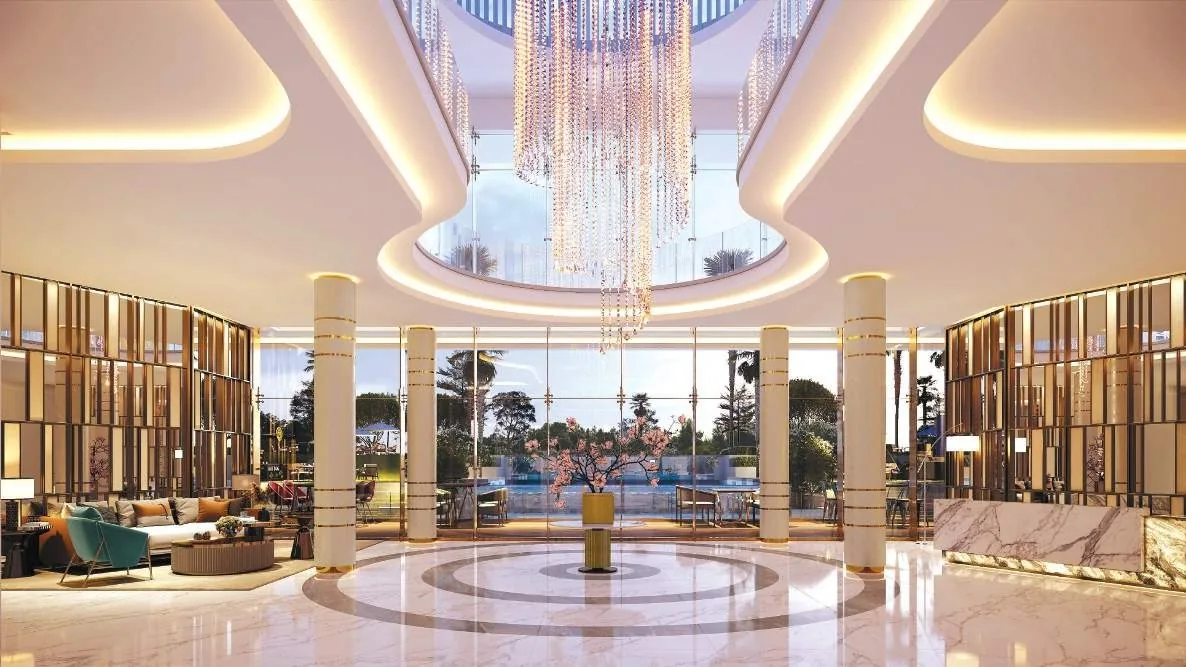Grand double-height lobby with chandelier at M3M Soulitude