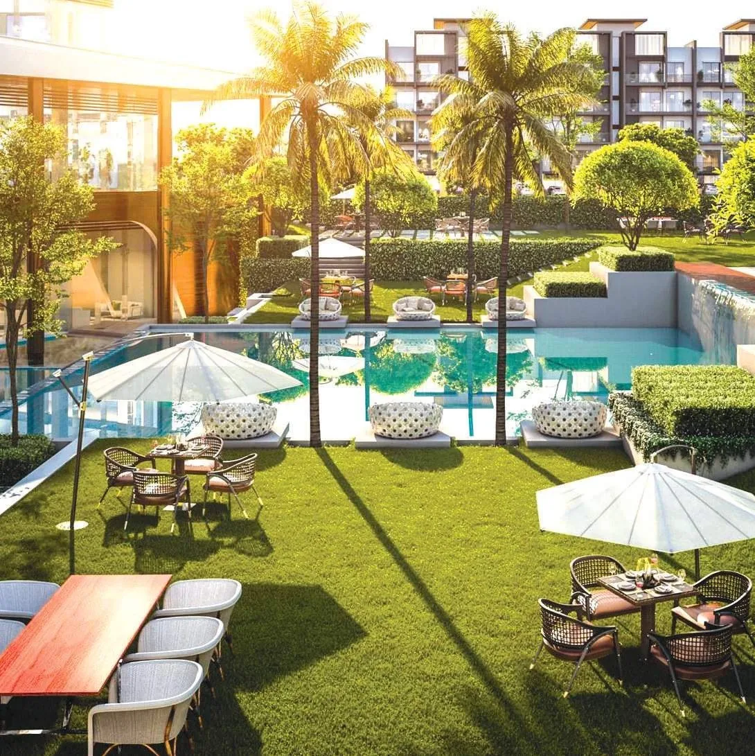 Landscaped club and pool deck with cabanas at M3M Soulitude