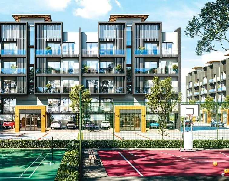 Tennis and basketball courts framed by boutique-floor buildings at M3M Soulitude